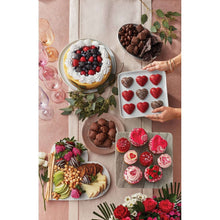 Milk chocolate sea salt caramels and assorted truffles on a serving tray