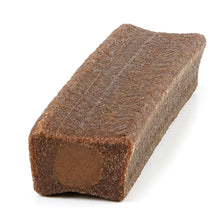 Brown dog chew bone with dark interior end, rectangular cross-section