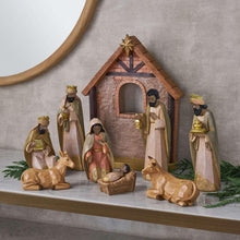 Nativity set with wooden stable and figurines, cream and gold tones