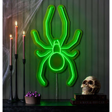 Green neon spider wall decor with outlined legs and circular abdomen