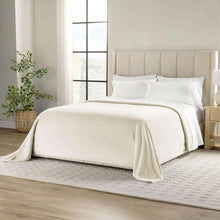 Oversized cloud-touch blanket in light beige with soft textured weave