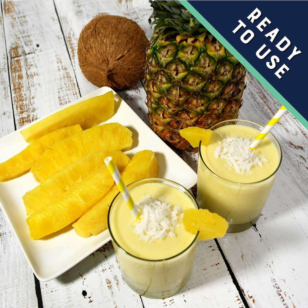 Pineapple spears, sliced pineapple, and coconut milk drink with straws