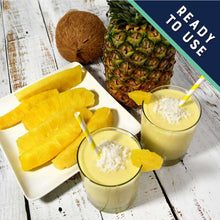 Pineapple spears, sliced pineapple, and coconut milk drink with straws