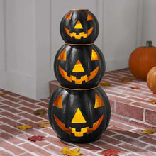 Pre-lit black metal jack-o-lantern set of 3 with stacked pumpkin faces and orange cutouts