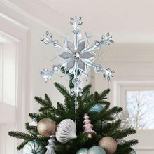 Silver snowflake Christmas tree topper with lit-edged cutout design and hanging stem