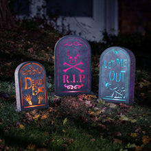 Three arched pre-lit graveyard tombstones with glowing R.I.P, Dead, and Let Me Out designs