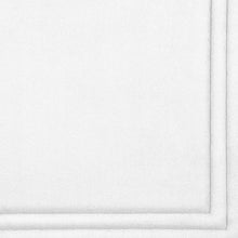 White memory foam bath mat with textured surface and rounded edges