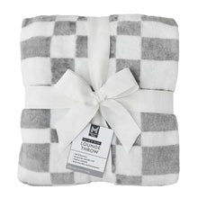 Folded gray and white buffalo check lounge throw blanket with bow