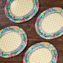 Set of floral oval paper plates with green rim and yellow patterned centers