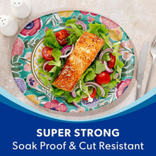 Floral oval paper plate holding salmon salad