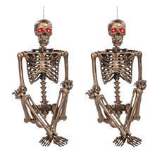 Talking skeleton decoration set of 2, front view with glowing red eyes and spread stance