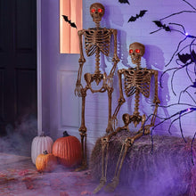Talking skeleton decoration set of 2 with glowing red eyes and jointed arms