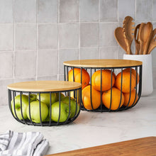 Set of 2 round black wire baskets with bamboo lids, for fruits or pantry.