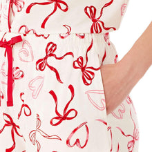 Pajama shorts waist with red ribbon drawstring and allover bow print, elastic back
