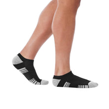 Black no-show athletic socks on a model foot, cushioned heel and toe