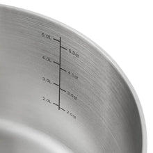 Stainless steel pot interior with volume measurement markings in quarts