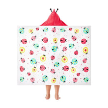 Kids' hooded towel with ladybug-style print back, white towel with red hood opening