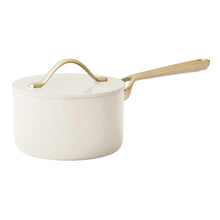 Cream ceramic saucepan with lid and gold-tone handles
