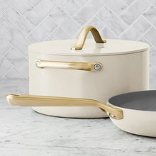 Cream ceramic stockpot with lid and gold-tone handles