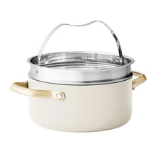 Cream ceramic stockpot with stainless lid and gold-tone side handles