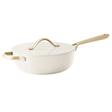 Cream ceramic saucepan with lid and gold-tone handles
