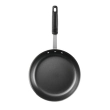Round nonstick fry pan with black handle, showing dark interior and side rivets