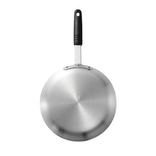Silver aluminum fry pan with black handle and riveted neck
