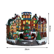 Pre-lit musical village with miniature houses and lit evergreen tree, 26cm wide