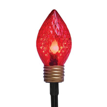 Red teardrop LED bulb with textured globe and black base on cord