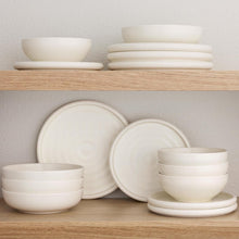 Cream bubble reactive dinnerware set, stacked bowls and plates