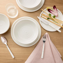 Cream bubble reactive dinnerware set with plates, bowls, and utensils