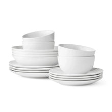 White porcelain dinnerware set: stacked plates and bowls