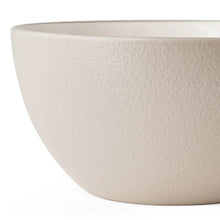 Textured stoneware bowl in light taupe with matte finish and curved rim