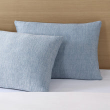 Light blue cooling pillow pair with textured weave, square corners, and subtle stitching