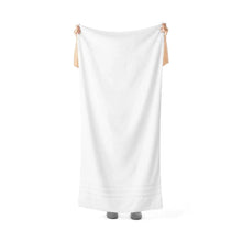 Arctic White bath sheet, folded towel hanging with corner tassel ties