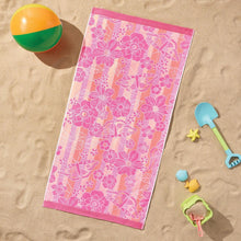 Pink floral kids beach towel with purple border and decorative corner motifs