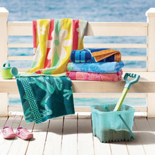Kids beach towels, multicolored stacked with striped and floral patterns