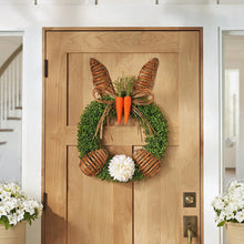 22-inch woven bunny wreath with green foliage, white flower, and brown carrot accents