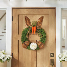 Woven bunny wreath with green foliage, carrot accents, and plaid bow, 22-inch