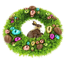 Chocolate bunny tinsel wreath with green tinsel and brown rabbit centerpiece surrounded by ornaments