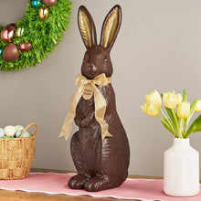 Chocolate bunny décor with dark brown body, beige ribbon, and “Happy Easter” tag