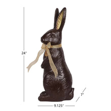 Chocolate bunny décor with gold ribbon, height 24 in and base 9.125 in wide
