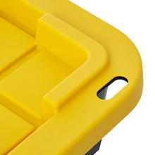 Yellow lid handle on black storage tote, close-up