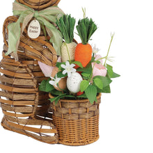 Woven bunny decor close-up: spring bouquet with eggs, carrot, and green leaves
