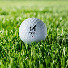 White golf ball on green grass with Member's Mark logo and '1' marking