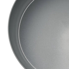 Gray ceramic nonstick fry pan interior with curved rim and smooth surface