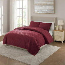 Merlot diamond-quilt comforter set with two coordinating pillow shams on bed