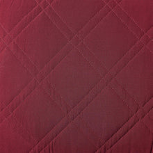 Merlot diamond-quilt stitched fabric detail with repeating diamond pattern