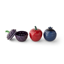 Stoneware berry canister set, three berry-shaped canisters with green, red, and blue stems.
