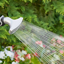 Garden sprayer nozzle spraying a fine multi-line water fan